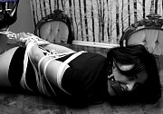 hogtied in ropes kinky horny nympho dirty bitch sucking housewife tied up women bound and gagged detective magazine cover girls classic black and white vintage HOM rope Bondage