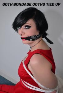 www.trussedup.com - Foxy Roxy soft core glam goth tattooed rope bondage model tied up in boots thumbnail