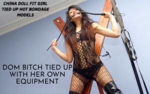 www.trussedup.com - strung up China doll  tied up with flesh cutting rope st Andrews cross bondage thumbnail